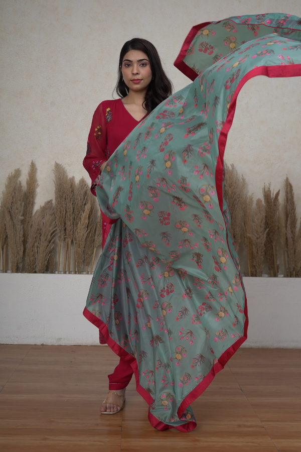 Coral Red pure georgette machine embroidered salwar suit.